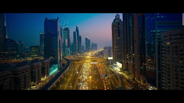Video Reference: Skyscraper, Building, Sky, World, Automotive lighting, Electricity, Dusk, Tower block, Condominium, Urban design