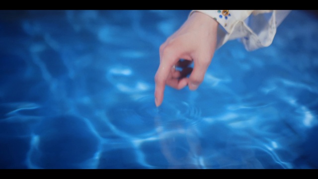Video Reference: Water, Cloud, Sky, Azure, Petal, Gesture, Flash photography, Finger, Electric blue, Nail