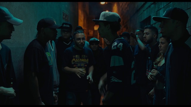 Video Reference: Cap, Flash photography, Hat, Baseball cap, Entertainment, Headgear, T-shirt, Midnight, Event, Electric blue