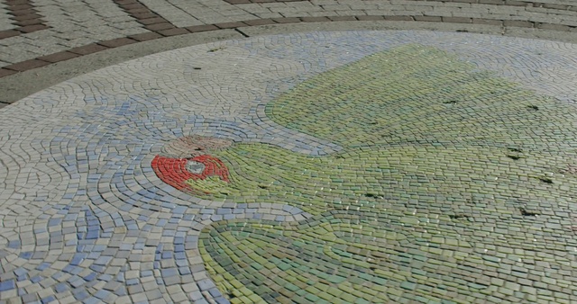 Video Reference: Road surface, Flooring, Urban design, Asphalt, Sidewalk, Art, Landscape, Pattern, Groundcover, Grass