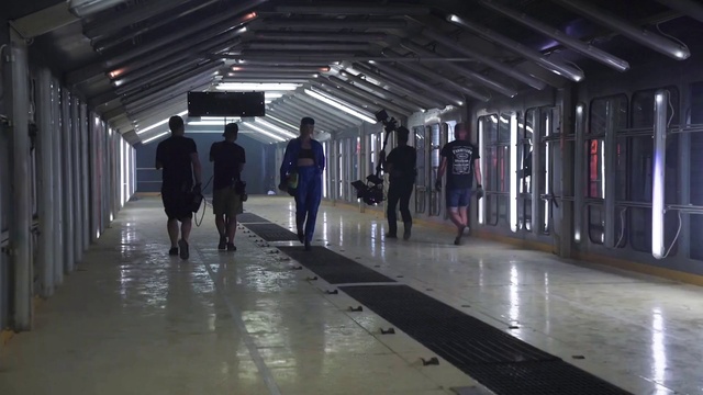 Video Reference: Trousers, Standing, Public space, City, Flooring, Urban area, Pedestrian, Event, Darkness, Suit