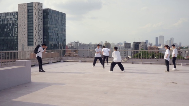 Video Reference: Footwear, Trousers, Sky, Cloud, Building, Gesture, Leisure, Recreation, City, Travel