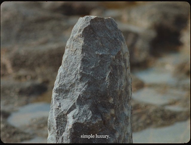Video Reference: rock, stone, close-up, outdoor, landscape, blurred background, nature, texture, standing stone, boulder, minimalism, text overlay