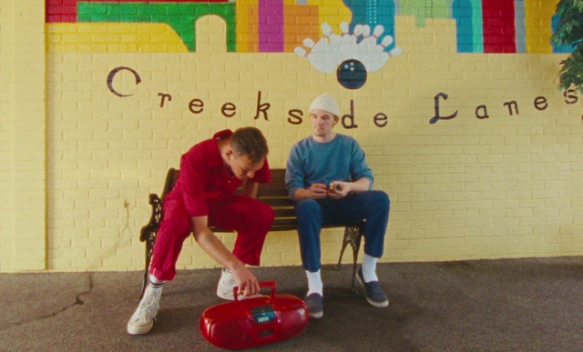 Video Reference: Shorts, Leg, Yellow, Red, Leisure, Happy, Chair, Recreation, Knee, Fun