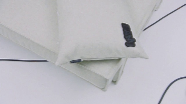 Video Reference: Sleeve, Rectangle, Collar, Font, Linens, Pattern, Fashion accessory, Paper product, Paper, Transparency