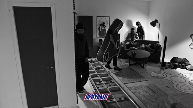 Video Reference: Standing, Automotive design, Chair, Couch, Black-and-white, Style, Door, Flooring, Audio equipment, Monochrome