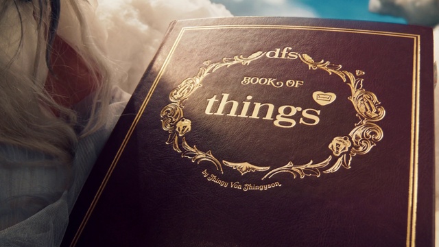 Video Reference: Brown, Book, Font, Amber, Emblem, Publication, Metal, Brand, Fashion accessory, Circle