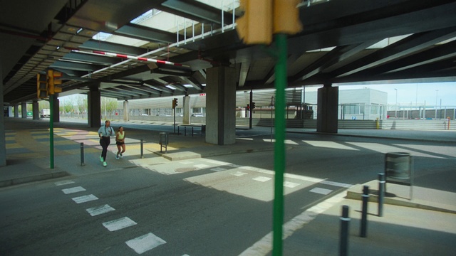 Video Reference: Building, Transport hub, Shade, Public space, Fixture, Parking, Road, Metropolitan area, Sidewalk, Public transport