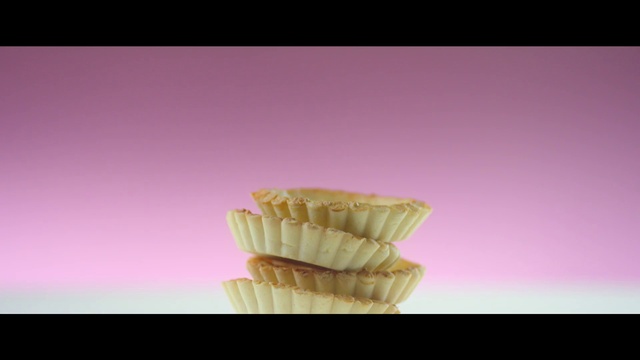 Video Reference: Cloud, Food, Jaw, Ingredient, Petal, Baking cup, Gesture, Pink, Violet, Cuisine