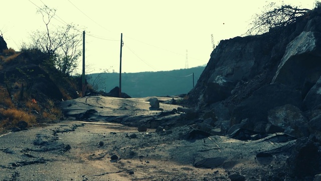 Video Reference: Sky, Slope, Overhead power line, Asphalt, Tree, Electricity, Road surface, Mountainous landforms, Geological phenomenon, Landscape