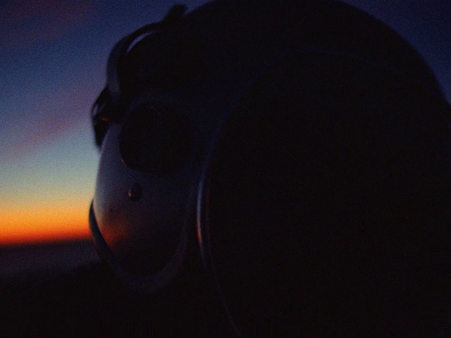 Video Reference: Sky, Flash photography, Automotive lighting, Helmet, Electric blue, Cloud, Space, Darkness, Personal protective equipment, Circle