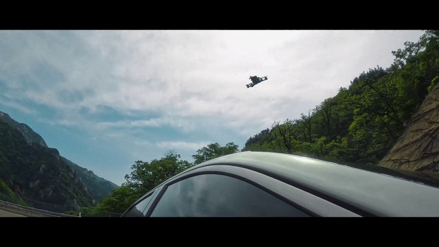 Video Reference: Cloud, Sky, Tree, Plant, Automotive mirror, Mountain, Automotive exterior, Tints and shades, Cumulus, Landscape