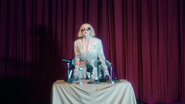 Video Reference: Purple, Table, Textile, Curtain, Theater curtain, Entertainment, Pink, Performing arts, Fashion design, Magenta