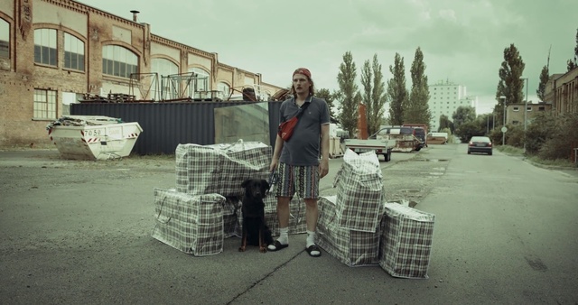 Video Reference: Sky, Road surface, Tree, Automotive tire, Asphalt, Architecture, Motor vehicle, Tartan, Wood, Grass