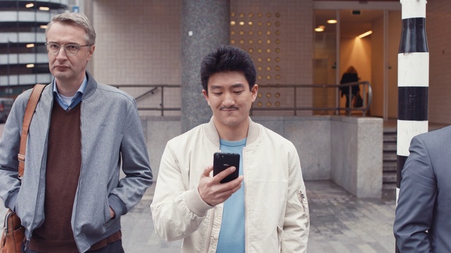 Video Reference: Dress shirt, Sleeve, Gesture, Collar, Social group, Street fashion, Event, White-collar worker, Formal wear, Fun