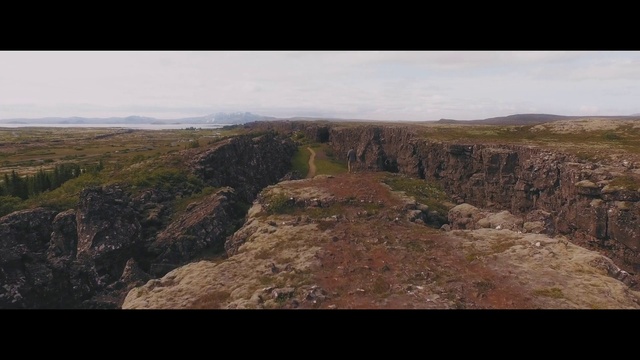 Video Reference: Sky, Bedrock, Mountain, Natural landscape, Slope, Formation, Outcrop, Landscape, Cloud, Grassland