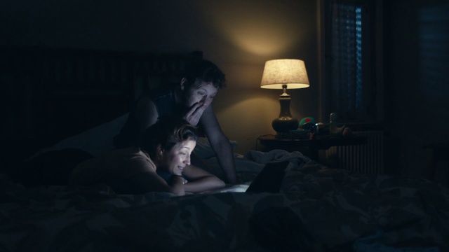 Video Reference: Comfort, Flash photography, Lamp, Grey, Tints and shades, Facial hair, Living room, Darkness, Human leg, Pillow