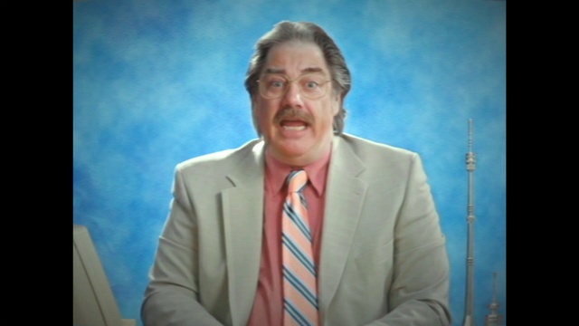 Video Reference: Forehead, Chin, Coat, Gesture, Television presenter, Tie, Spokesperson, Suit, Sky, Blazer