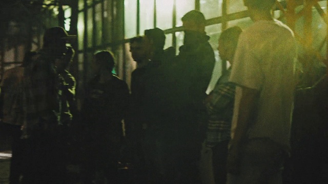 Video Reference: Midnight, Tints and shades, Font, Event, Hat, Darkness, Fun, Crowd, Room, City