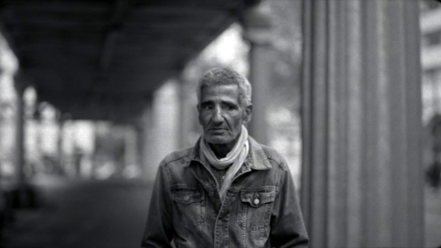 Video Reference: Flash photography, Grey, Black-and-white, Style, Headgear, Jacket, Beard, Leather jacket, Wrinkle, Road