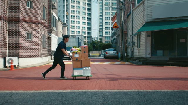 Video Reference: Building, Window, Road surface, Asphalt, Tire, Neighbourhood, Line, Public space, Sidewalk, Urban design