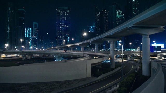 Video Reference: Street light, Infrastructure, Automotive lighting, Road surface, Sky, Mode of transport, Thoroughfare, Electricity, Cityscape, Building