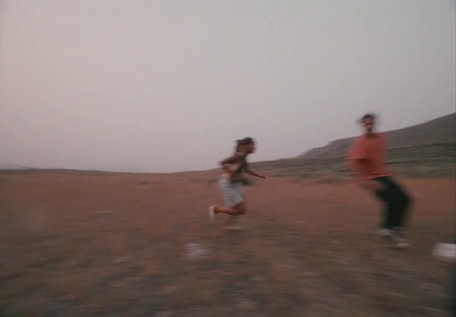 Video Reference: Sky, Shorts, Gesture, Atmospheric phenomenon, Horizon, Landscape, Aeolian landform, Singing sand, Sand, Soil