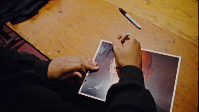 Video Reference: Hand, Wood, Gesture, Finger, Flooring, Font, Writing instrument accessory, Hardwood, Thumb, Nail