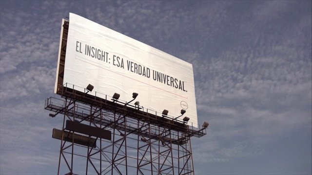 Video Reference: Sky, Cloud, Billboard, Building, Rectangle, Font, Composite material, Electricity, Signage, Advertising