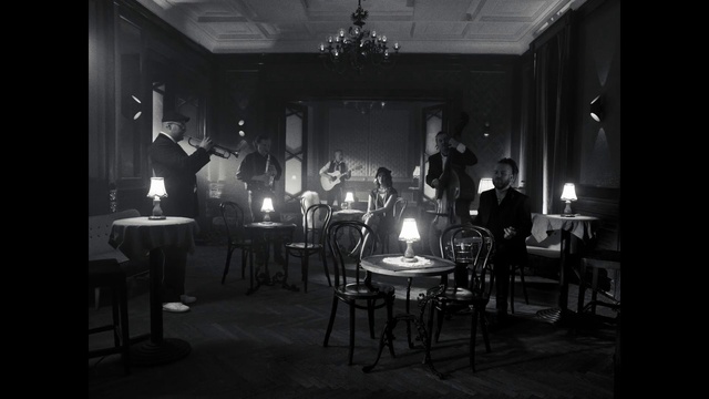 Video Reference: Furniture, Chair, Black-and-white, Entertainment, Style, Musician, Table, Suit, Flash photography, Monochrome