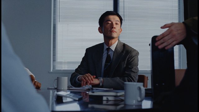 Video Reference: office, meeting, business, man, suit, conference table, discussion, interior, professional, desk, mugs, papers, window blinds, colleagues, corporate, portrait