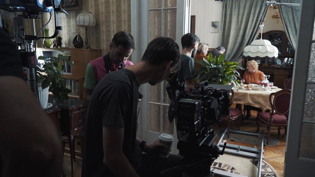 Video Reference: Plant, Houseplant, Musician, Table, Community, Chair, T-shirt, Window, Event, Cinematographer