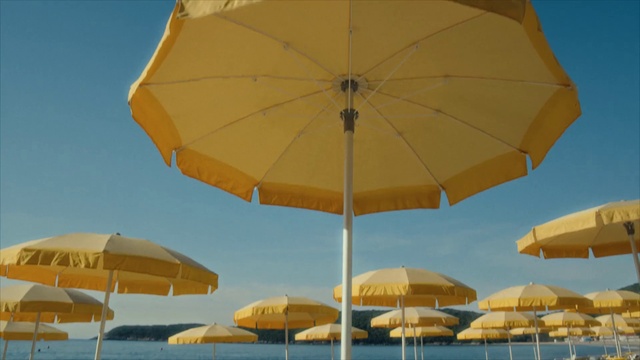 Video Reference: Sky, Water, Umbrella, Daytime, Photograph, Light, Nature, Shade, Azure, Natural environment