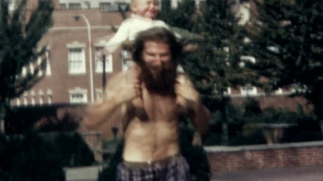 Video Reference: outdoor, man, child, shoulders, shirtless, street, trees, buildings, blurry, family, play, urban, daylight