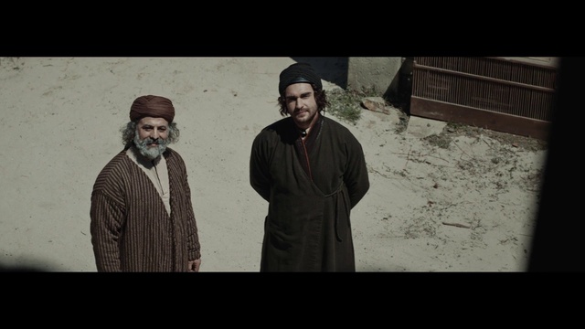 Video Reference: Beard, Flash photography, Sleeve, Headgear, Tints and shades, Eyewear, Smile, Hat, Facial hair, Cap