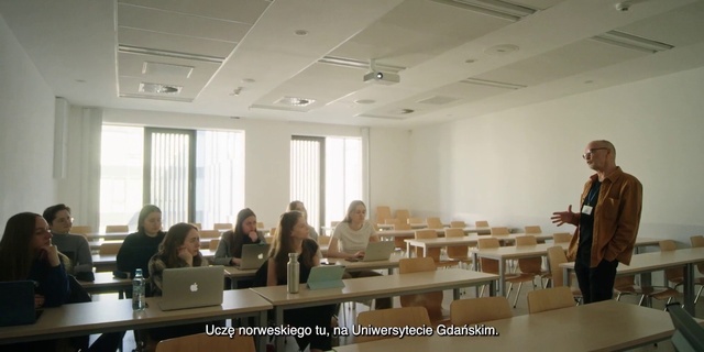 Video Reference: Furniture, Table, Computer, Laptop, Chair, Building, Interior design, Event, Conference hall, Desk