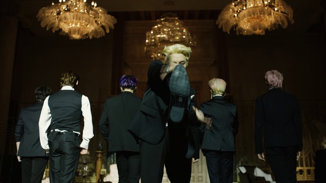 Video Reference: Coat, Entertainment, Interaction, Suit, Art, Chair, Performing arts, Event, Formal wear, Crowd