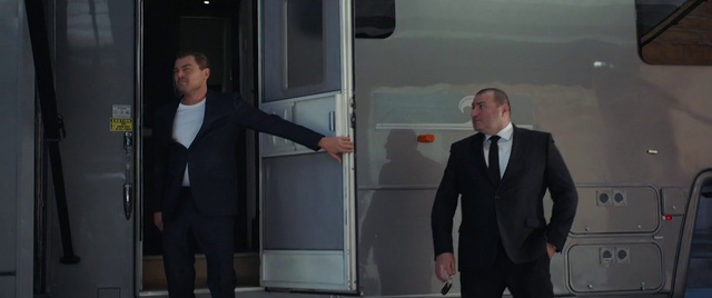 Video Reference: Suit trousers, Shoulder, Sleeve, Gesture, Dress shirt, Grey, Suit, Collar, Blazer, Formal wear