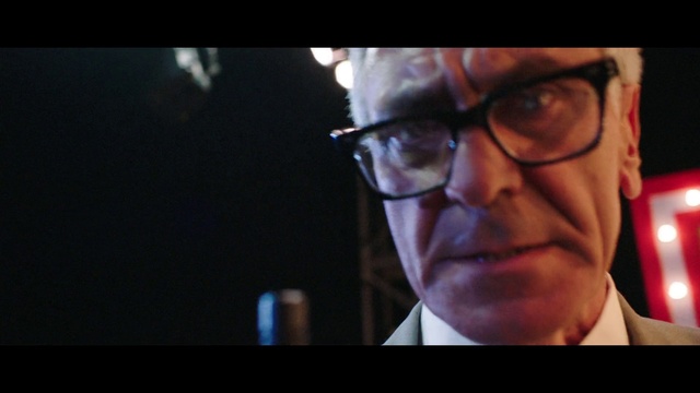 Video Reference: Glasses, Vision care, Jaw, Eyewear, Flash photography, Facial hair, Beard, Event, Hat, White-collar worker