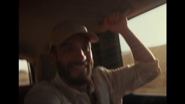 Video Reference: Arm, Eyebrow, Mouth, Flash photography, Cricket cap, Jaw, Sleeve, Beard, Gesture, Hat