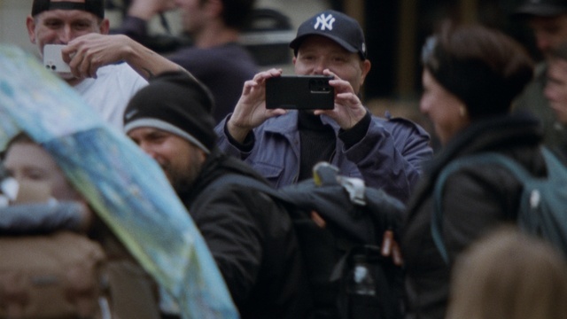 Video Reference: Photographer, Cap, Hat, Baseball cap, Camera, Event, Crowd, Cameras & optics, Single-lens reflex camera, Street