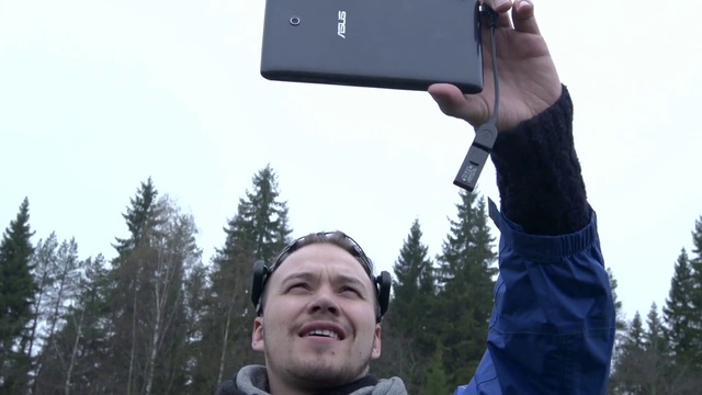 Video Reference: Outerwear, Sky, Smile, Tree, Gesture, Finger, Travel, Communication Device, Gadget, Elbow