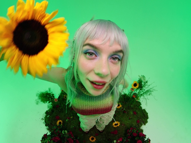 Video Reference: Smile, Eye, Facial expression, People in nature, Plant, Eyelash, Happy, Organism, Iris, Grass