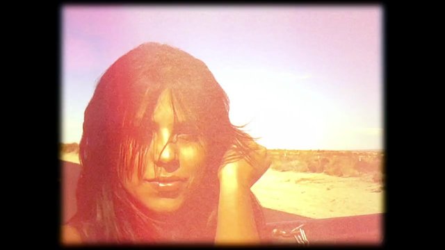 Video Reference: portrait, close-up, outdoors, desert, sunlight, long hair, person, bright, retro, warm tone