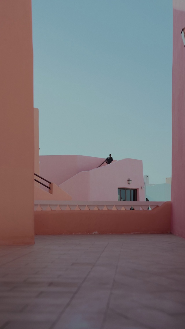 Video Reference: Sky, Door, Shade, Landscape, Tints and shades, Facade, Composite material, Concrete, Horizon, Magenta