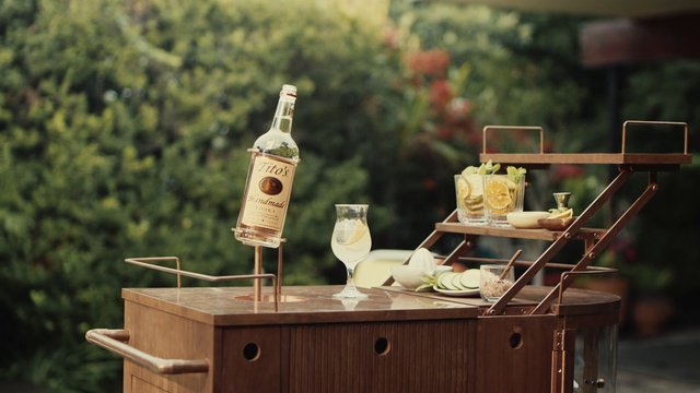 Video Reference: outdoor, bar cart, cocktails, vodka, bottle, glassware, citrus, garnish, garden, lifestyle, beverage, party, serving tray, summer, drinks