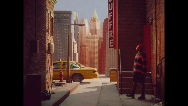 Video Reference: Car, Tire, Building, Automotive lighting, Vehicle, Wheel, Skyscraper, Automotive design, Orange, Motor vehicle