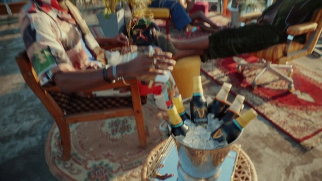 Video Reference: Outdoor furniture, Leisure, Event, Fun, Hat, City, Market, Plastic, Tree, Recreation