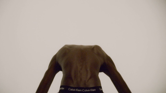 Video Reference: Arm, Human body, Sleeve, Gesture, Waist, T-shirt, Elbow, Wood, Rectangle, Fashion design