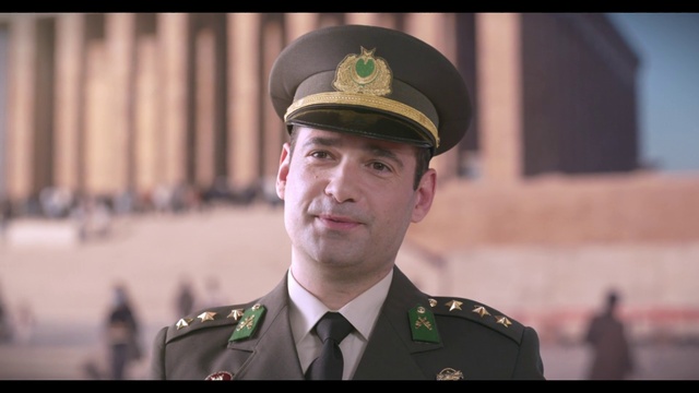 Video Reference: Photograph, Military uniform, Coat, Military person, Dress shirt, Gesture, Tie, Non-commissioned officer, Collar, Cap